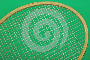 Part of a brown old badminton racket