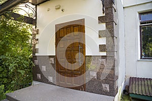 Part of a building facade with the surface of granite wall. Natural stone materials