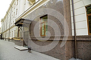 Part of a building facade with the surface of granite wall. Natural stone materials