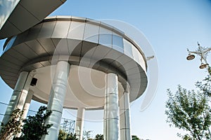 Part of the building in futuristic style with CCTV camera