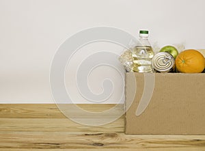 Part of a cardboard box for food donations. Free space for text, side view
