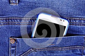 Part of cellphone in blue jeans pocket