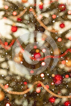 Part of a Christmas tree decorated with lights - soft focus