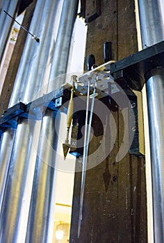 part of the church organ with many air pipes made of metal