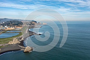 Part of city Constitucion Chile and coastline Pacific Ocean, aerial view photo