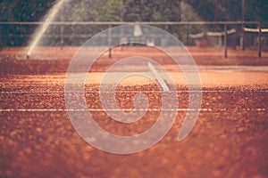 Part of a clay tennis court and the net