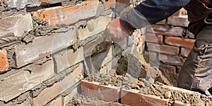 A bricklayer building a wall