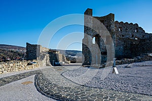 Part of the courtyard and buildings of DevÃ­n Castle in Bratislava. Blue sky