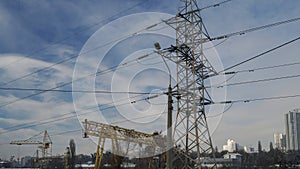 Part of the crane and electricity pylon.