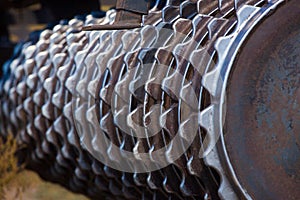 Part of the cultivator, steel, gear wheels in a row.