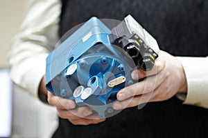 Part of the diesel engine in hands closeup