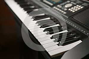 Part of a digital piano synthesizer keyboard, music concept, selected focus