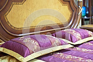 Part of a double bed with decorative headboard