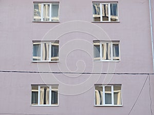 Part of the facade of a building under construction.