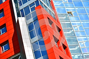 Part of the facade modern building with red and blue