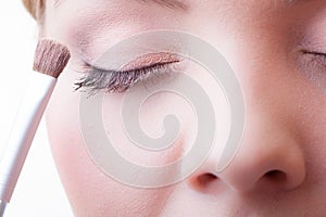 Part of face female eye makeup applying with brush