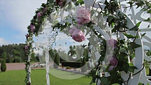 Part of the festive decor, floral arrangement. Detail of a wedding arch. Wedding decoration ceremony Chandelier in the