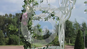 Part of the festive decor, floral arrangement. Detail of a wedding arch. Wedding decoration ceremony Chandelier in the