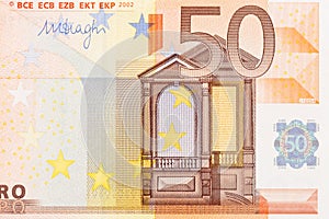 Part of Fifty Euro banknote. Euro currency in Europe. Financial colorful background. Concept of printing money from the