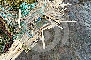 part of a fishing net on the ground