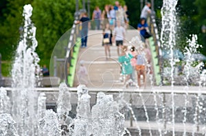 Part fountain with people background