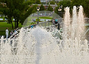 Part fountain with people background