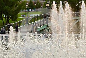 Part fountain with people background