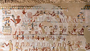 Part of a fresco in TT69 with Menna and Henut-Tawy seated at a ceremonial meal.