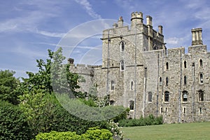 Part of the gardens and towers of the ancient Windsor Castle Royal residence in the town of Windsor in Berkshire England