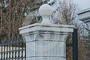Part of a gray concrete column