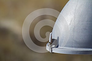 Part of a hemispherical street lamp with a metal cramp