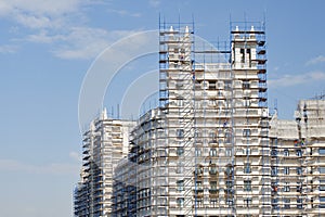 Part of the high-rise building in scaffolding.