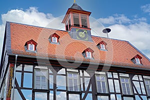 part of historic building, beautiful facade ancient half-timbered house of European German architecture, tileable roof, historic