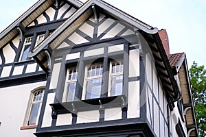 part of historic building, beautiful facade ancient half-timbered house of European German architecture, wood patterns, historic