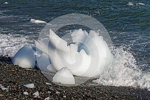 Part of an iceberg washed on shore.