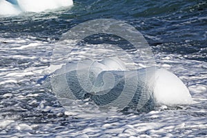 Part of an iceberg washed on shore.