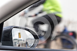 Part inside view of a car, a car mirror and a partial view of a