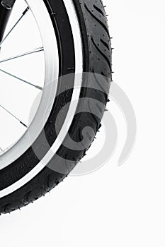 Part of kids bicycle wheel with spokes, white background