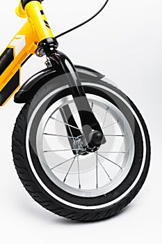 Part of kids bicycle wheel with spokes, white background