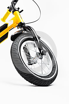 Part of kids bicycle wheel with spokes, white background