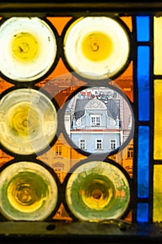 Part of Krakow`s Old Town through colored glass