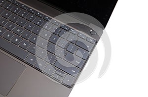 Part of laptop keyboard and touchpad of opened laptop isolated on white top view