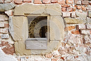 Part of Medieval castle in ruin with windows with sandstone jamb.