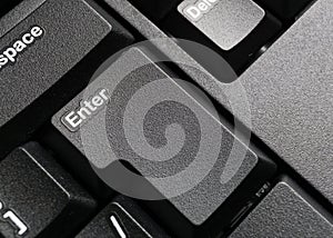 Part of modern black computer keyboard with enter button