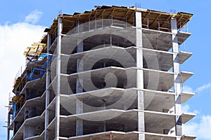 Part of modern building under construction and sky