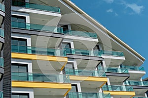 Part of a modern residential flat exterior of an apartment building. Detail of a new luxury home and residential complex