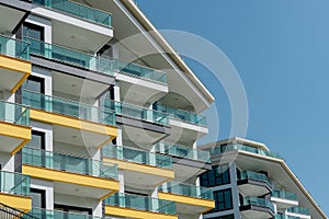 Part of a modern residential flat exterior of an apartment building. Detail of a new luxury home and residential complex