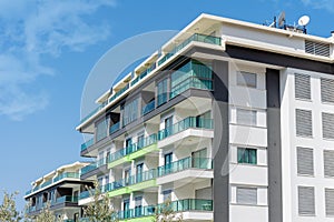 Part of a modern residential flat exterior of an apartment building. Detail of a new luxury home and residential complex