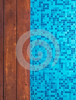 A part of modern swimming pool with wooden border