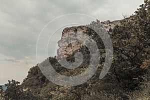 A part of the mountain rock. The top of the cliff in front of the abyss.